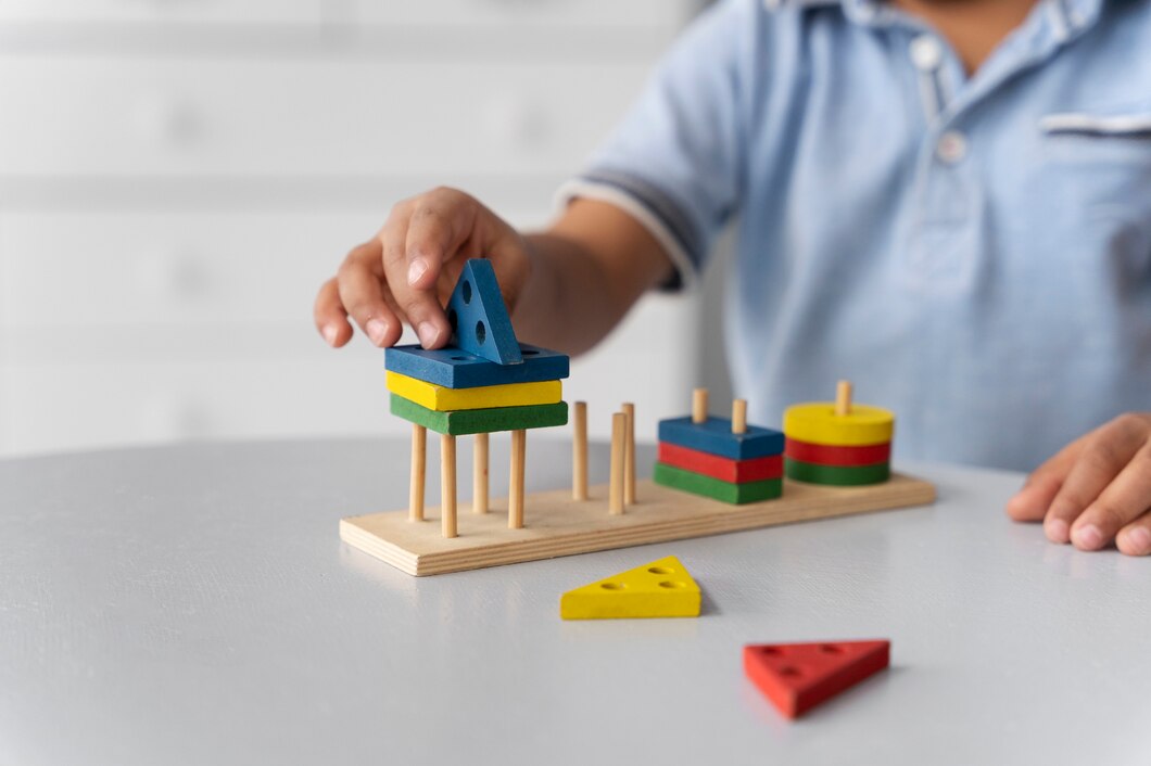 Close Up Child Enjoying Didactic Game | Play and Dream Toys UAE